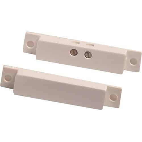 Two beige door sensors on a white background