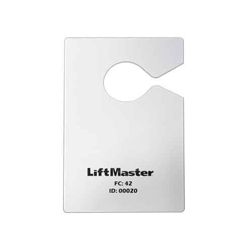 Metallic tag with 'LiftMaster' branding on a white background