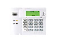 White home security system panel with digital display and buttons on a white background