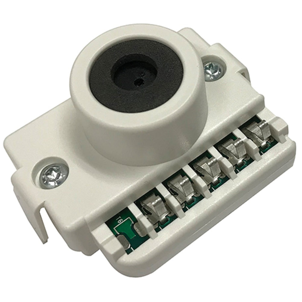 white device with black center and electronic components on a white background
