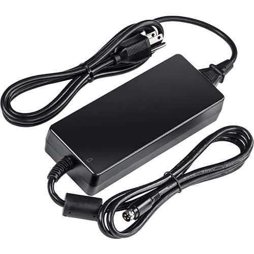 Black power adapter with multiple cables on a white background