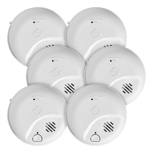 Set of six white smoke detectors on a white background