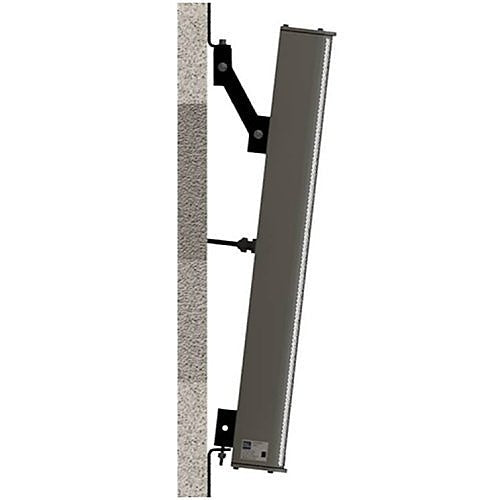 A long, rectangular electronic device mounted vertically onto a textured wall