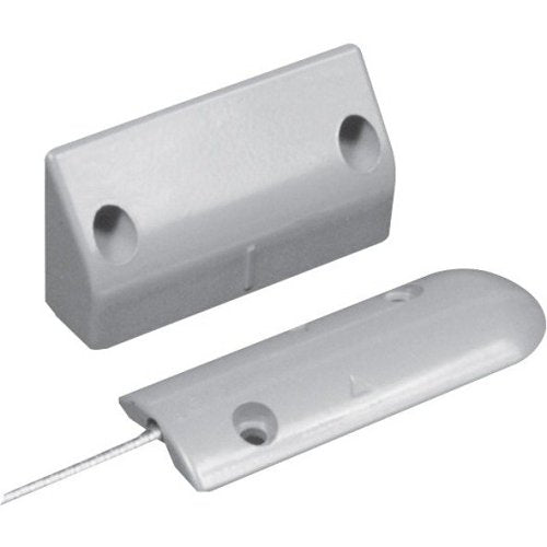 Two white rectangular door sensors on a white background