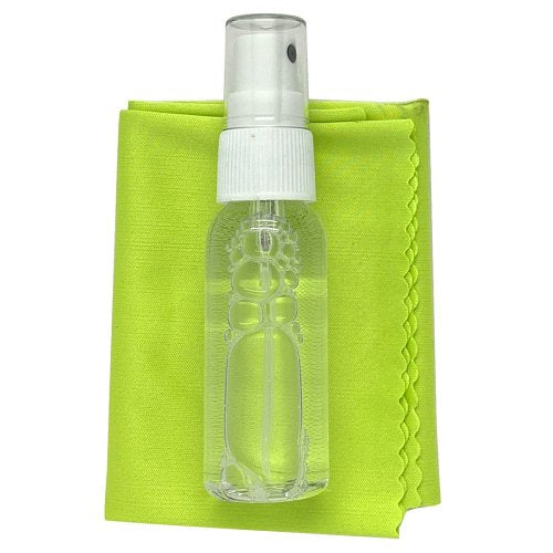 Clear spray bottle with white cap on a green cloth