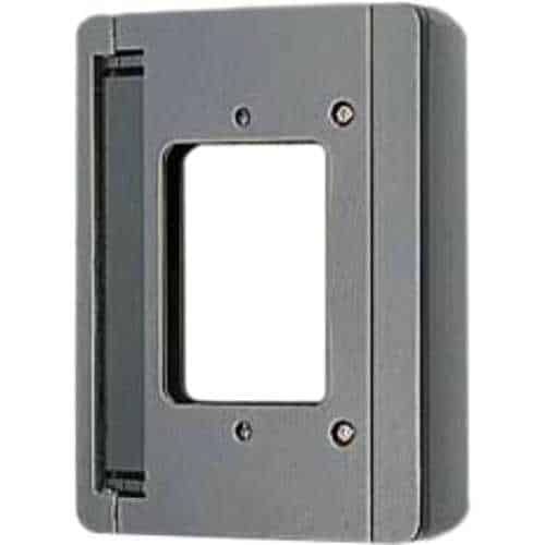Dark gray, rectangular surface-mount box designed to mount a device like an intercom or video doorbell onto a wall at an angle