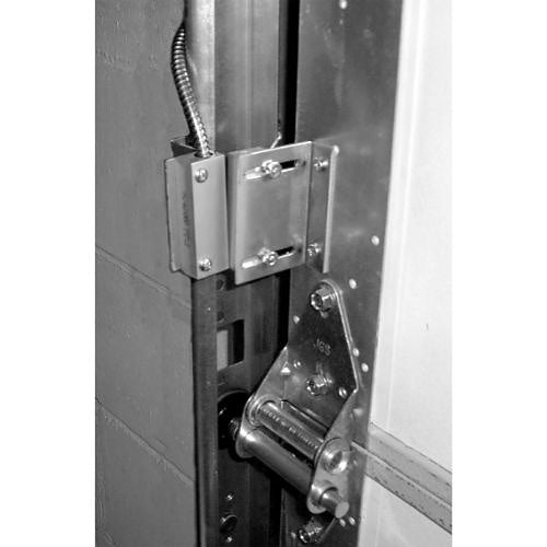 Metallic door lock mechanism on a door with a white background