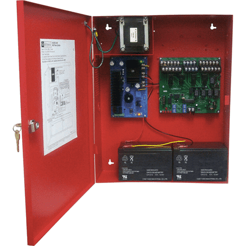 Red electrical panel with various components including a battery and circuit boards.