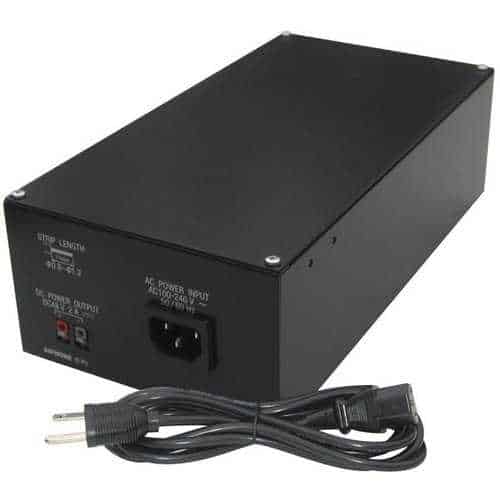 Black power supply unit with a cable on a white background