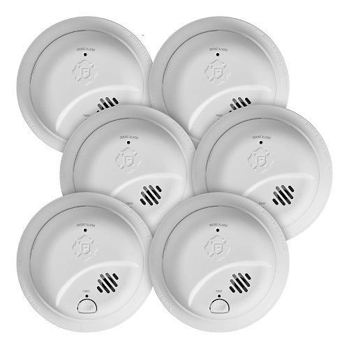 Set of six white smoke detectors on a white background