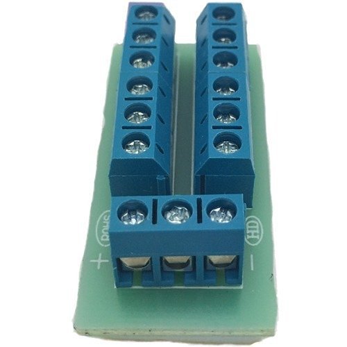 Blue electrical connector on a green base with visible brand logo.