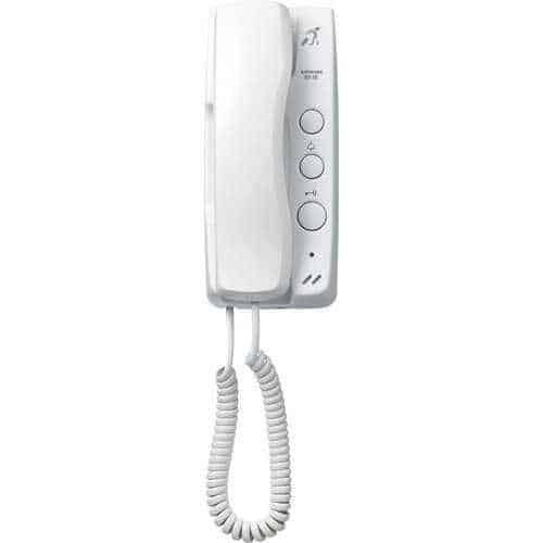 White wall-mounted phone with coiled cord on a white background