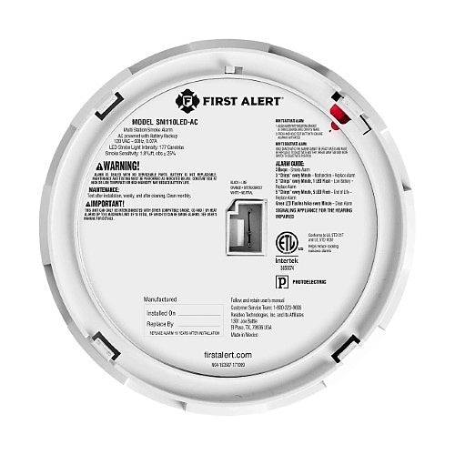 Back view of a First Alert smoke alarm with label and specifications.