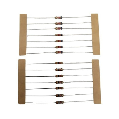 Two sets of electronic resistors mounted on tan cardboard strips against a white background.