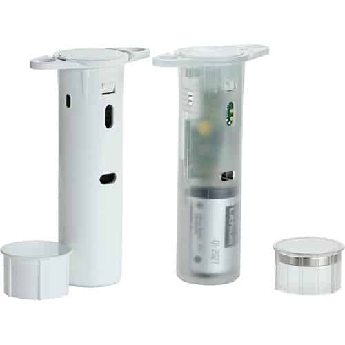 Set of white and clear cylindrical containers with various components on a white background