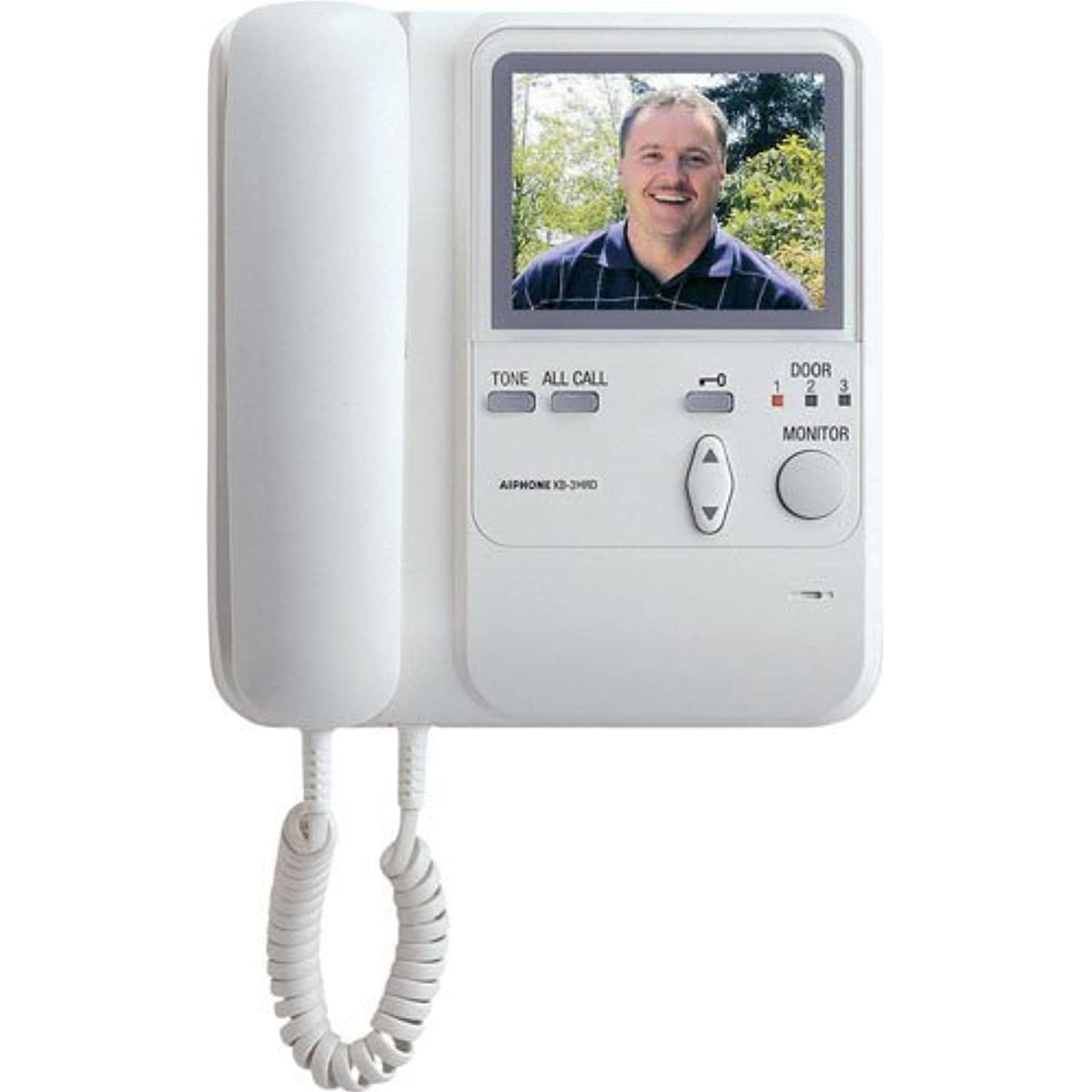 White, wall-mounted video intercom master station on a white background