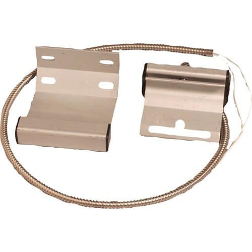 Commercial garage door magnetic contact switch on a white background